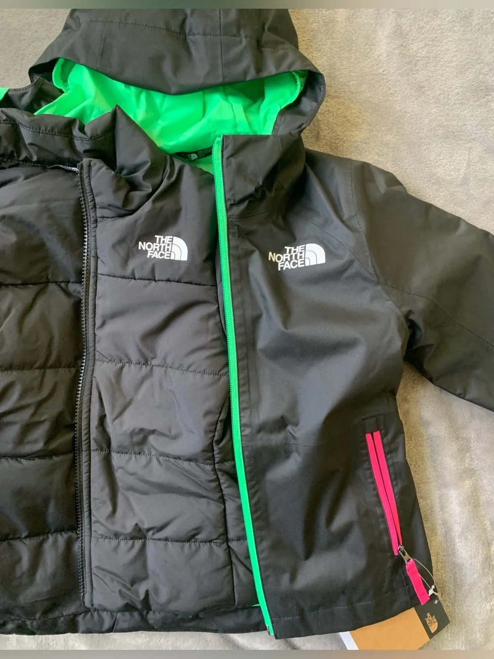 The North Face Black Hooded Jacket with Green Lining & Pink Zippers